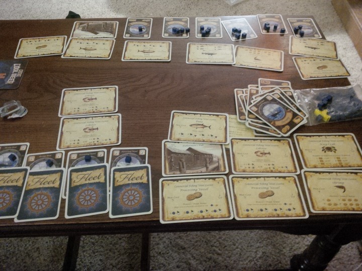 A two-player game of Fleet set up on a coffee table.
